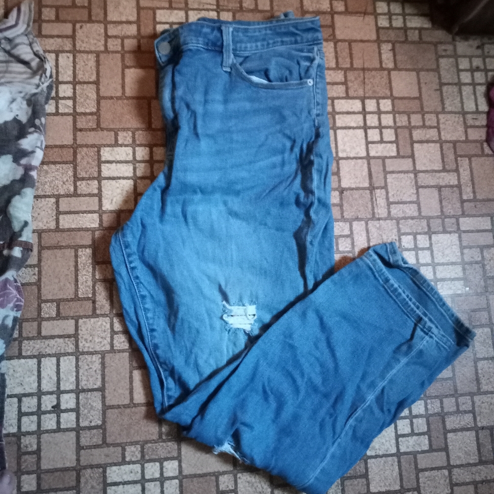 Distressed high rise jeans with patches under the holes. Size 18w